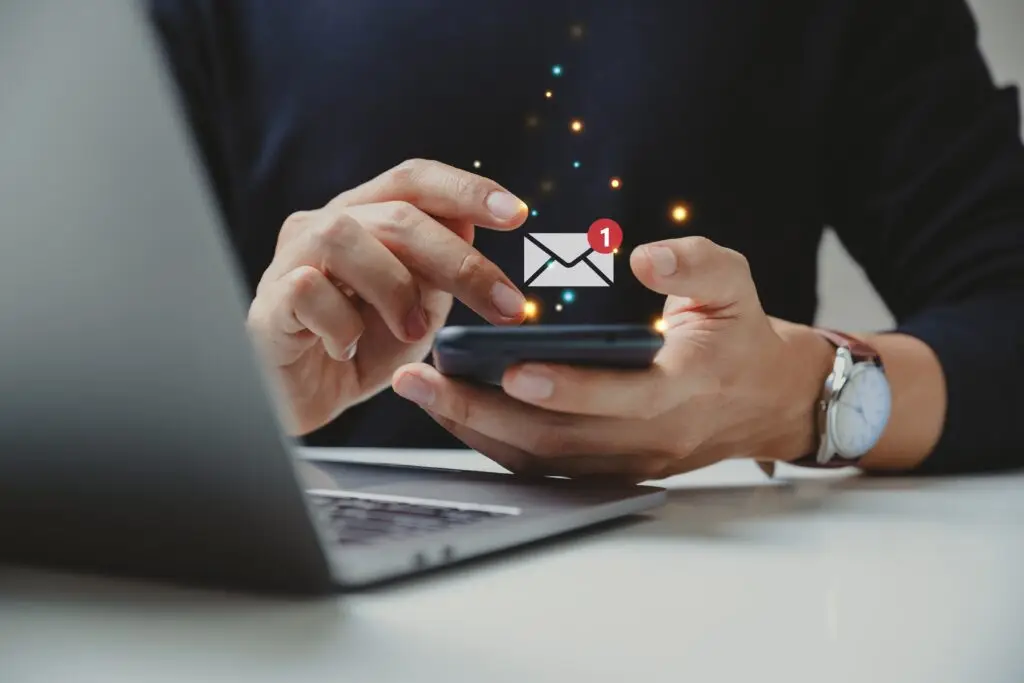 Hand,Of,Businessman,Using,Smartphone,For,Email,With,Notification,Alert,