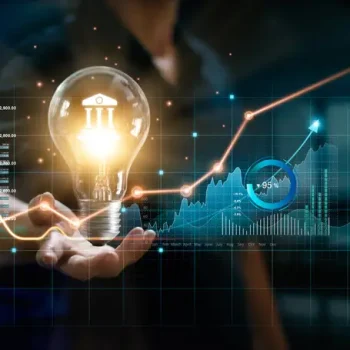 Businessman,Holding,Creative,Light,Bulb,With,Growth,Graph,And,Banking